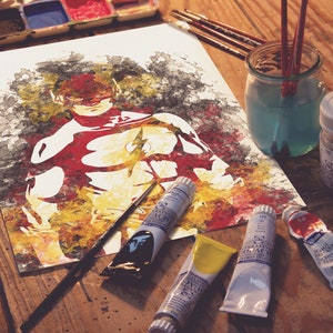 May include: A watercolor painting of the Flash superhero on a white sheet of paper. The painting is surrounded by paint tubes, brushes, and a jar of water. The paint tubes are red, yellow, and blue.
