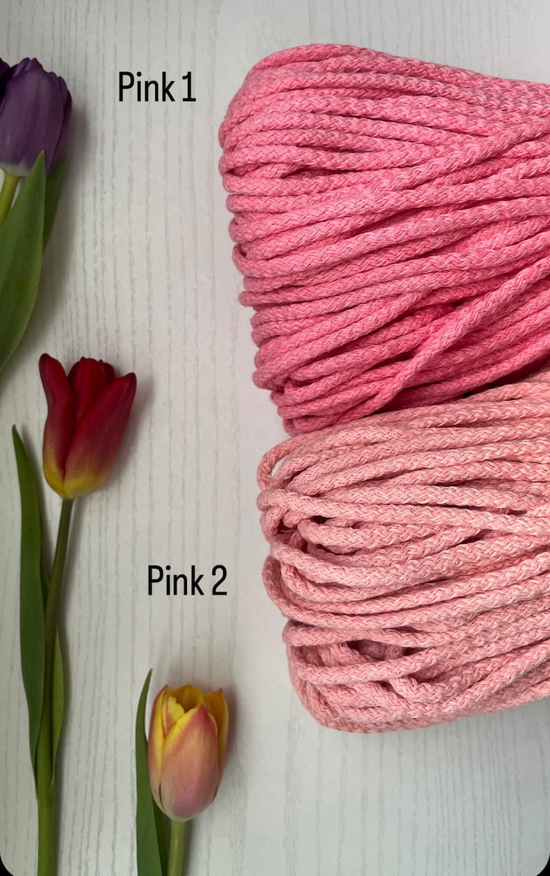 May include: Two spools of pink cotton rope, one a lighter pink and the other a darker pink. The spools are labeled "Pink 1" and "Pink 2".