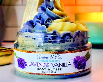 May include: A jar of lavender vanilla body butter with a swirl of purple and yellow cream on top. The jar has a label that says "Amani & Co. Skincare Products Lavender Vanilla Body Butter 8 oz | 236 ml."