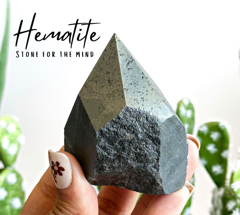 May include: A dark gray, faceted hematite crystal point. Hematite is known as the "Stone for the Mind".
