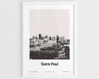 May include: A black and white photograph of the Saint Paul skyline, Minnesota, United States. The image shows a cityscape with tall buildings and a river in the foreground. The text "Saint Paul" is printed below the image, along with the city's incorporation date and coordinates.