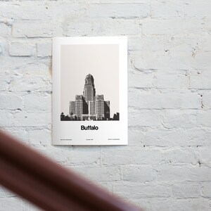 May include: Black and white illustration of the Buffalo City Hall building, with the word "Buffalo" printed below the building.