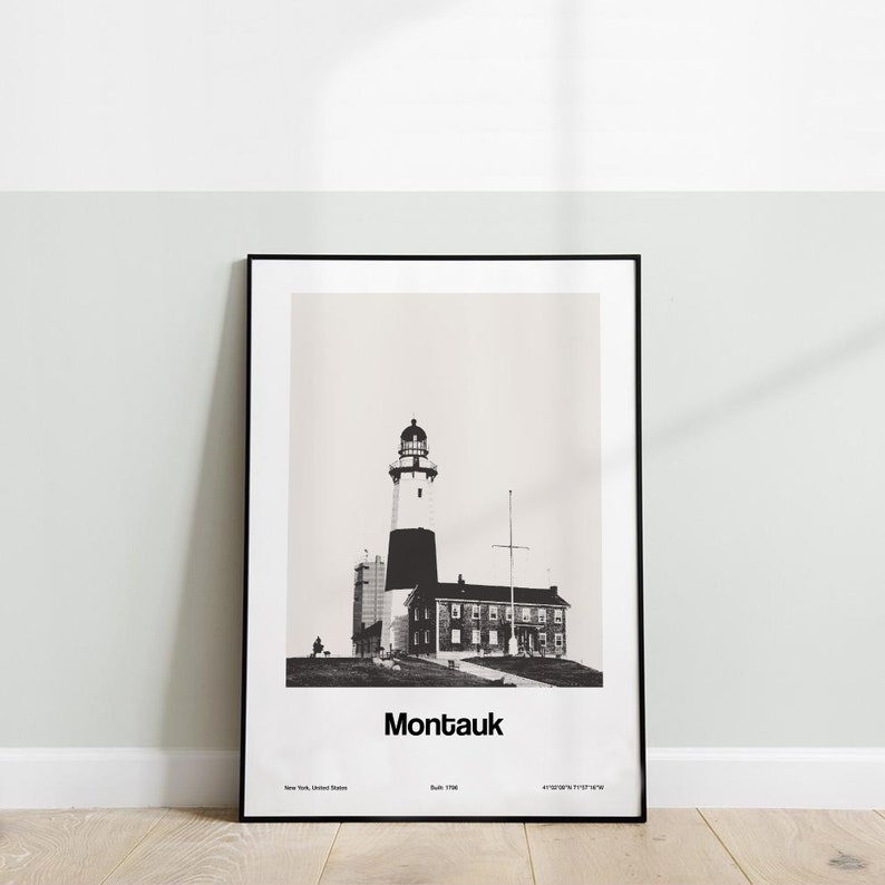 May include: Black and white photograph of Montauk Point Lighthouse in New York, United States. The lighthouse is a tall, white tower with a black top and a black and white striped band. The lighthouse is surrounded by a small building with a white roof and black windows. The text "Montauk" is printed below the image.