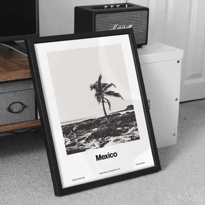 May include: Black and white framed print of a palm tree on a beach with the word "Mexico" printed below the image. The print also includes the text "Capital: Mexico City" and "Independence: 16 September 1810".