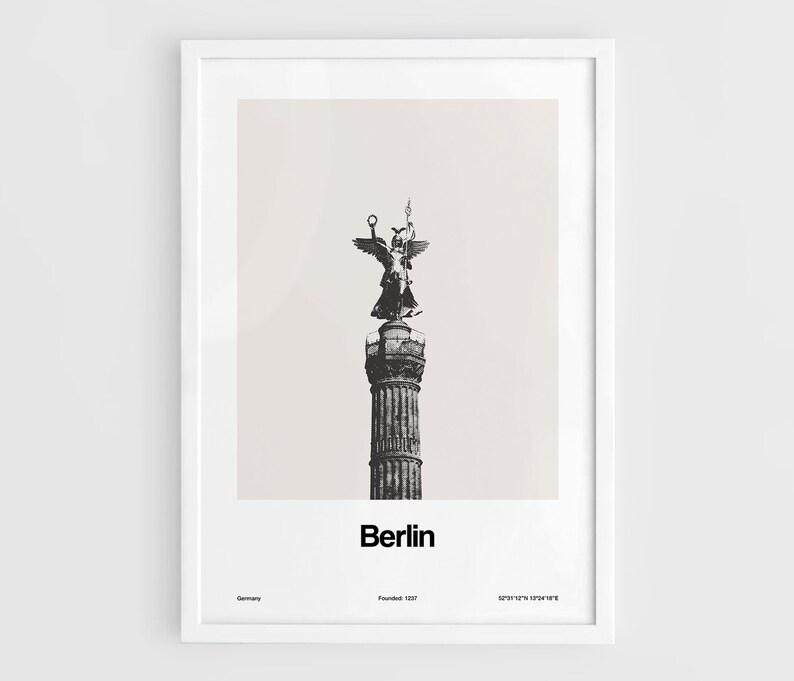 May include: A black and white photograph of the Victory Column in Berlin, Germany. The column is topped with a statue of the goddess Victoria, holding a laurel wreath and a cross. The text "Berlin" is printed below the image, along with the city's founding date, "Founded 1237", and the coordinates "52&deg;31'12"N 13&deg;24'18"E".