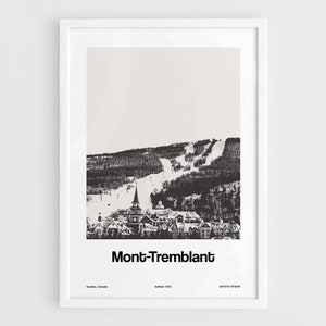 May include: A black and white photograph of a ski resort town in the mountains. The town is nestled in a valley with snow-covered slopes in the background. The text "Mont-Tremblant" is printed below the image.