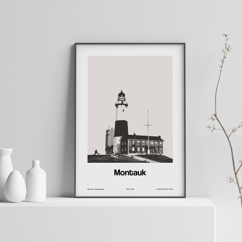 May include: Black and white photograph of Montauk Point Lighthouse in New York, United States. The lighthouse is a tall, white tower with a black top and a black lantern. The lighthouse is surrounded by a small building with a white facade and black trim. The text "Montauk" is printed below the image.