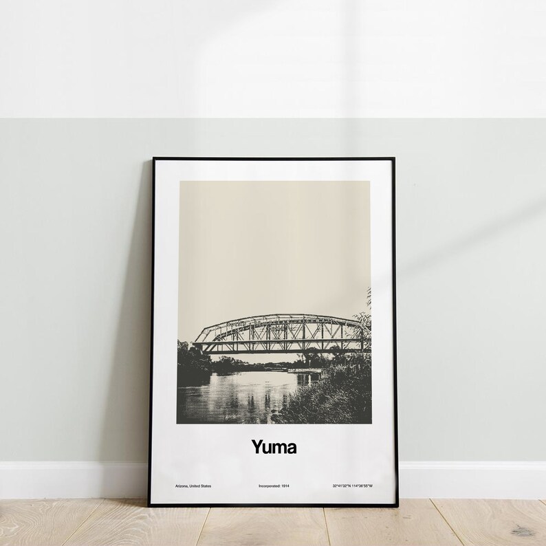 May include: A black and white photograph of a bridge over a river. The image is in a black frame and has the word "Yuma" printed below the image. The text "Arizona, United States" and "Incorporated 1871" are printed below the word "Yuma".