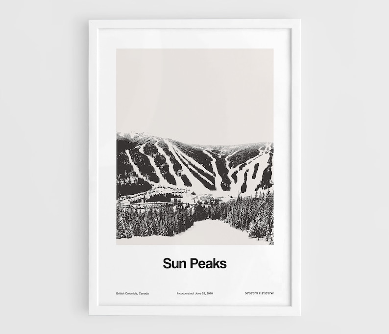 May include: A black and white photograph of a ski resort called Sun Peaks, located in British Columbia, Canada. The image shows a mountain with ski runs and trees.