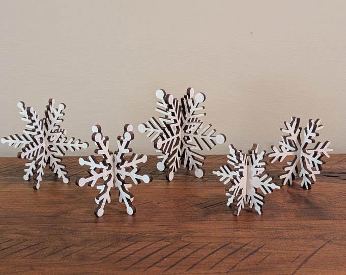 Featured listing image: 3D Wooden Snowflake Set – Rustic Winter Christmas Décor | Laser Cut Maple Snowflakes | Farmhouse Holiday Table Centerpiece