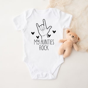 My aunties rock bodysuit for babies. Cute rock and roll handmade infant apparel. Baby shower gift idea. Devil's horn rocker aunties rockstar