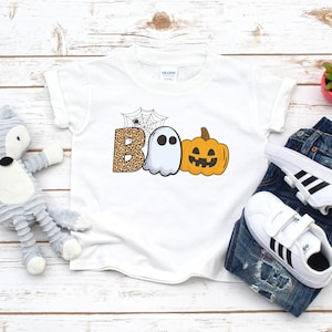 Boo Halloween shirt for kids, Cute pumpkin and ghost design for children, Jack-o-lantern and cobwebs on a spooky kid design, Cute adorable