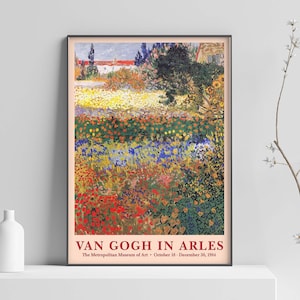 May include: A vintage poster advertising an exhibition of Van Gogh's work in Arles at the Metropolitan Museum of Art. The poster features a painting of a field of colorful flowers with a house in the background. The text on the poster reads "Van Gogh in Arles" and "The Metropolitan Museum of Art - October 18 - December 30, 2004."