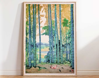 May include: A framed print of a Japanese woodblock print depicting a forest of tall, blue-green bamboo stalks. The forest is in the foreground, with a river and hills in the background. There are small pink figures in the foreground.