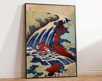 Könnte beinhalten: Ein japanischer Holzschnitt aus der Zeit, der einen Wasserfall mit einer roten Klippe und eine Person auf einem Pferd zeigt. Der Druck ist in Schwarz gerahmt und hat japanischen Text in der oberen linken Ecke.