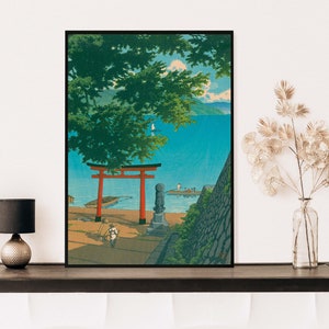 May include: A vintage Japanese woodblock print depicting a red torii gate, a stone statue, and a view of a blue lake with a small boat. The scene is framed by lush green trees and a stone wall.