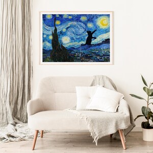 May include: A framed print of a black cat silhouette jumping in front of a starry night sky, reminiscent of Vincent van Gogh's 'Starry Night'. The cat is facing the viewer and appears to be reaching for a crescent moon.