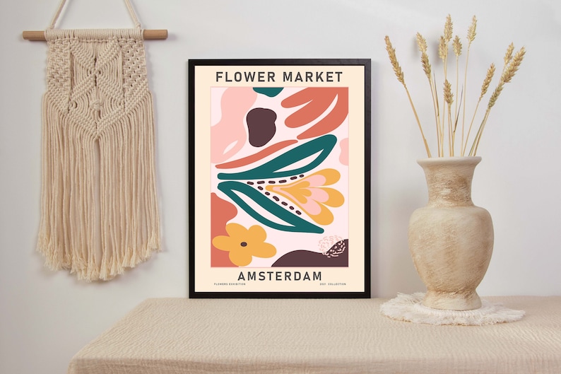 K&ouml;nnte beinhalten: Ein gerahmtes Poster mit einem farbenfrohen abstrakten Blumendesign. Das Poster tr&auml;gt den Text "FLOWER MARKET AMSTERDAM" unten.
