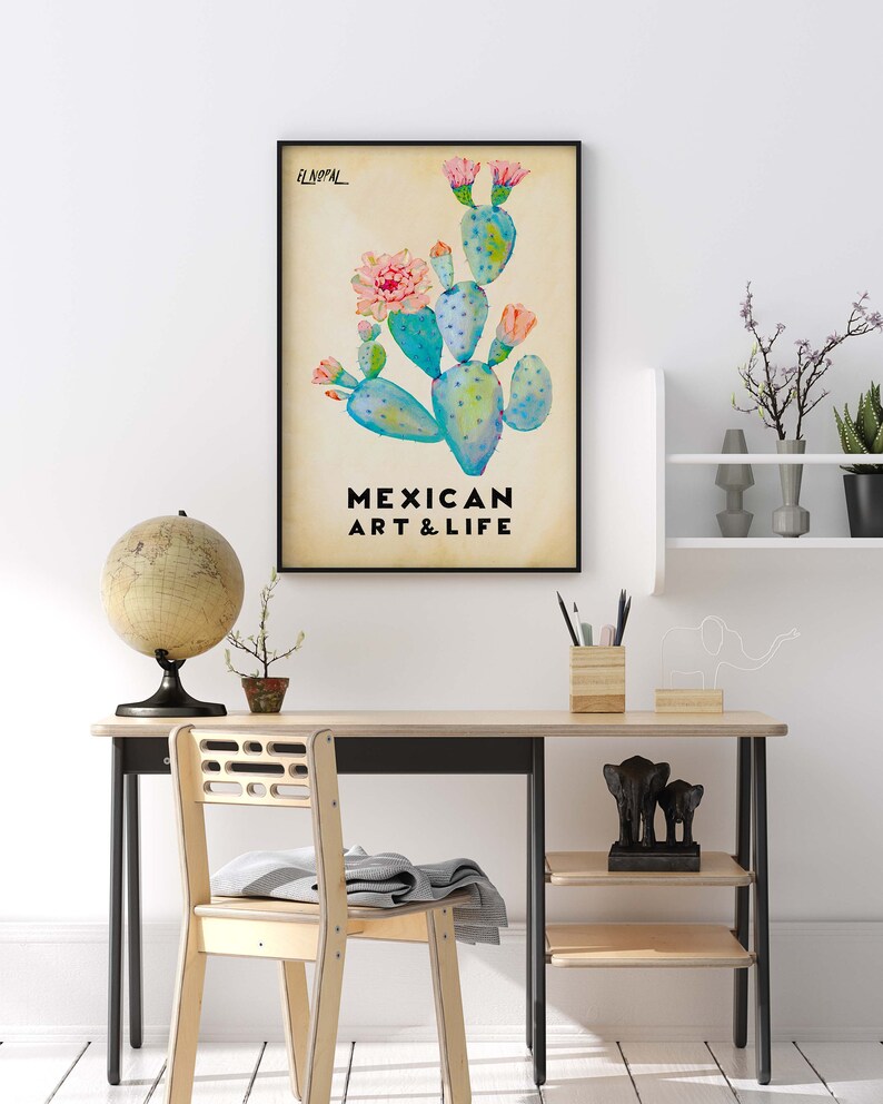 May include: A framed print with a watercolor illustration of a prickly pear cactus with pink flowers. The text "EL NOPAL" and "MEXICAN ART & LIFE" is printed below the illustration.