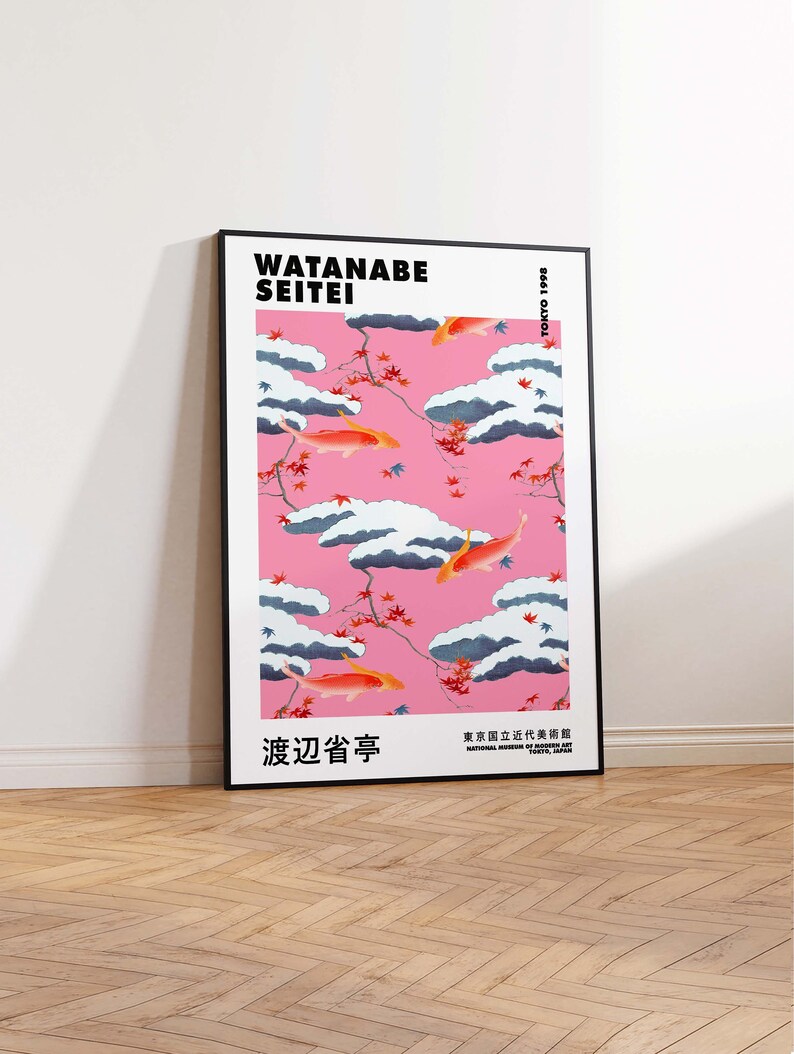 May include: A black framed poster with a pink background and a pattern of white clouds and orange fish. The text "WATANABE SEITEI" is at the top of the poster. The text "渡辺省亭" is in the lower left corner of the poster. The text "東京国立近代美術館" is in the lower right corner of the poster.