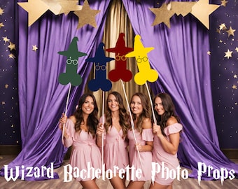 May include: Four women in pink dresses hold up wizard-themed photo booth props. The props are shaped like a wizard's hat and have a pair of glasses on the front. The props are green, blue, red, and yellow.