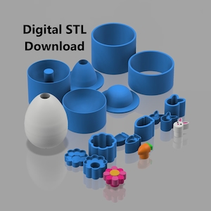 Può includere: Una collezione di stampi blu stampati in 3D e un oggetto bianco a forma di uovo. Gli stampi includono cilindri, coni e varie forme come fiori, carote e coniglietti. Il testo "Digital STL Download" è visualizzato in alto a sinistra.