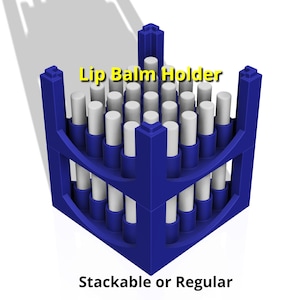 May include: A blue plastic lip balm holder with 24 slots for lip balm tubes. The holder is stackable or regular.  "Lip Balm Holder" is written in yellow text on the top of the holder.