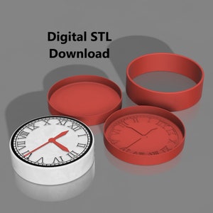 Puede incluir: Una esfera de reloj impresa en 3D con números romanos y una aguja de hora roja. La esfera del reloj es parte de un conjunto de cuatro piezas que se pueden ensamblar para crear un reloj.