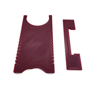 May include: Two red plastic tools for opening and closing a SIM card tray. The larger tool has a textured surface and a cutout for the SIM card. The smaller tool has a handle and a slot for the SIM card.