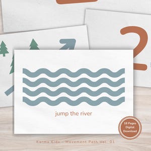 May include: A collection of white cards featuring illustrations and text for a children's movement activity. One card displays blue waves with the text "jump the river." Other cards show the number 2, footprints, trees, and an arrow. The cards are labeled "Karma Kids - Movement Path Vol. 01."