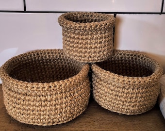 Small round jute baskets crocheted. Decorative basket for storage. Storage and organization bathroom. Rustic and farmhouse kitchen decor.r.