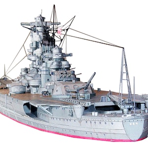 May include: A detailed model of a Japanese battleship, painted in a grey and brown colour scheme. The model features intricate details, including the ship's guns, masts, and rigging. The ship's hull is painted in a dark grey colour, and the deck is painted in a light brown colour. The model is set against a white background.