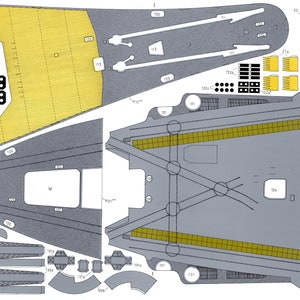May include: A paper model kit of a spaceship with detailed instructions and numbered parts. The model is made of grey and yellow paper and includes a variety of shapes and sizes.