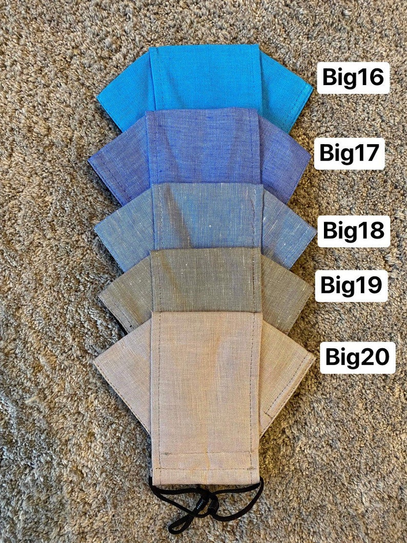 Pode incluir: Cinco m&aacute;scaras de tecido de diferentes cores, empilhadas umas sobre as outras. As m&aacute;scaras s&atilde;o etiquetadas de cima para baixo: Big16, Big17, Big18, Big19, Big20.