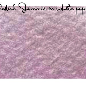 May include: A close-up of a shimmery, iridescent purple and pink paint on white paper. The paint has a textured, almost metallic look.