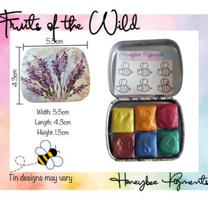 May include: A set of six watercolour paints in a metal tin with a lavender design. The tin is 5.5 cm wide, 4.3 cm long, and 1.5 cm high. The tin also features the text "Honeybee Pigments".