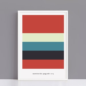 May include: A framed art print with a minimalist design of horizontal colour bands. The bands are red, off-white, teal, dark grey, and black. The text "mysterious skin - gregg araki - 2004" is printed at the bottom of the print.