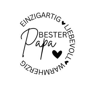 May include: A black and white graphic design with the words "EINZIGARTIG BESTER Papa LIEBEVOLL WARHERZIG" arranged in a circular pattern around the word "Papa". Black hearts are included in the design.