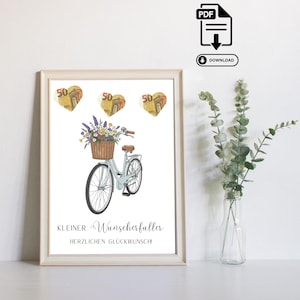 Puede incluir: Una impresión enmarcada con una ilustración en acuarela de una bicicleta azul claro con una cesta de flores. Encima de la bicicleta hay tres imágenes en forma de corazón con el número 50. El texto en la parte inferior dice "Kleiner Wunscherfüller Herzlichen Glückwunsch!"