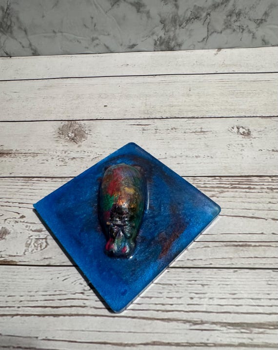 A custom resin 'house hippo' sculpture — a deeply niche internet-culture reference executed as a tiny one-of-a-kind art piece that will confuse and delight anyone who gets it.