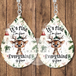May include: Two teardrop earrings with a festive design. Each earring displays a reindeer wearing a hat and fairy lights, with the words "It's fine, I'm fine, Everything is fine". The earrings have silver hooks.