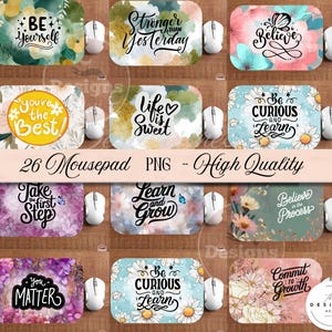 May include: A collection of rectangular mousepads with floral designs and inspirational quotes. The mousepads feature various color schemes, including blues, pinks, and yellows, with phrases like "Be Yourself" and "Believe." The image also includes computer mice.