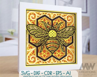 May include: A digital file for laser cutting a bee design with intricate details. The bee is surrounded by a honeycomb pattern and floral accents. The design is in black, yellow, and orange.