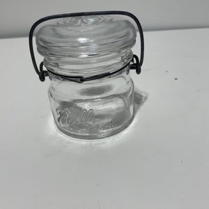 Small glass canning jar with a glass lid