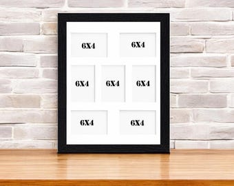 May include: Black picture frame with six 6x4 inch openings for photos. The frame is on a wooden surface.