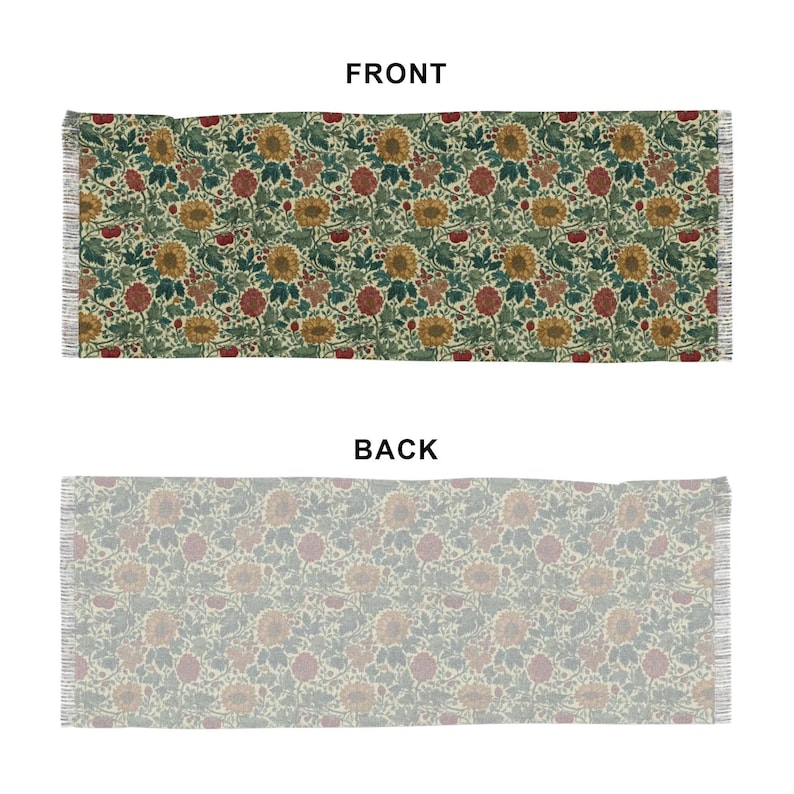 May include: Rectangular floral patterned rug with a cream background. The front side features a repeating pattern of sunflowers, red flowers, and green leaves. The back side has a muted floral design. The rug has fringed edges.