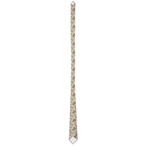 May include: A beige necktie with a repeating pattern of small, stylized leaf shapes. The tie is vertically oriented, with a pointed tip and a small, white label at the end. The overall design is simple and elegant.