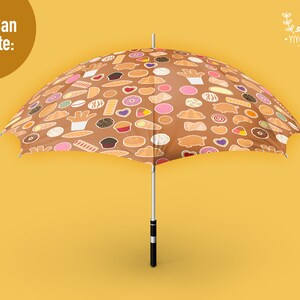 May include: A brown umbrella featuring a repeating pattern of various colorful cookies, pastries, and donuts. The text 'You Can Create:' appears in the top left corner, and a logo with the text 'YIYOCANEL' is visible in the top right corner.