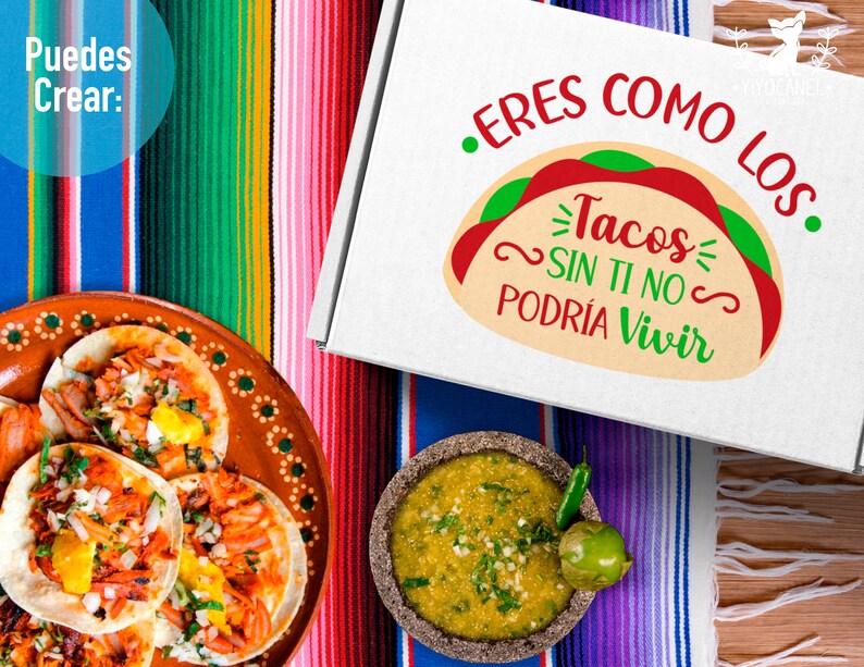 May include: A white box with the text "Eres como los Tacos Sin Ti No Podria Vivir" in green and red lettering. The box is sitting on a colourful striped blanket with a plate of tacos and a bowl of salsa.