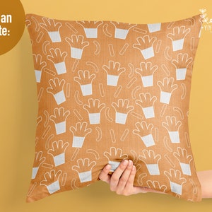 May include: A square throw pillow with a mustard yellow background featuring a repeating white line art pattern of french fry containers and individual fries. The top left corner includes the text You Can Create and the top right has YIYOCANEL.